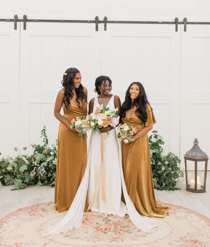 bridal party wearing mustard velvet Jenny Yoo online bridesmaid dresses