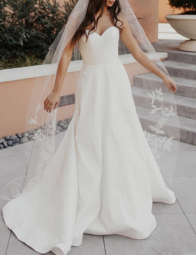 strapless wedding dress with lace detailed veil